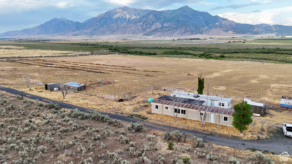 Birds eye view of property featuring a mountain view and a rural view