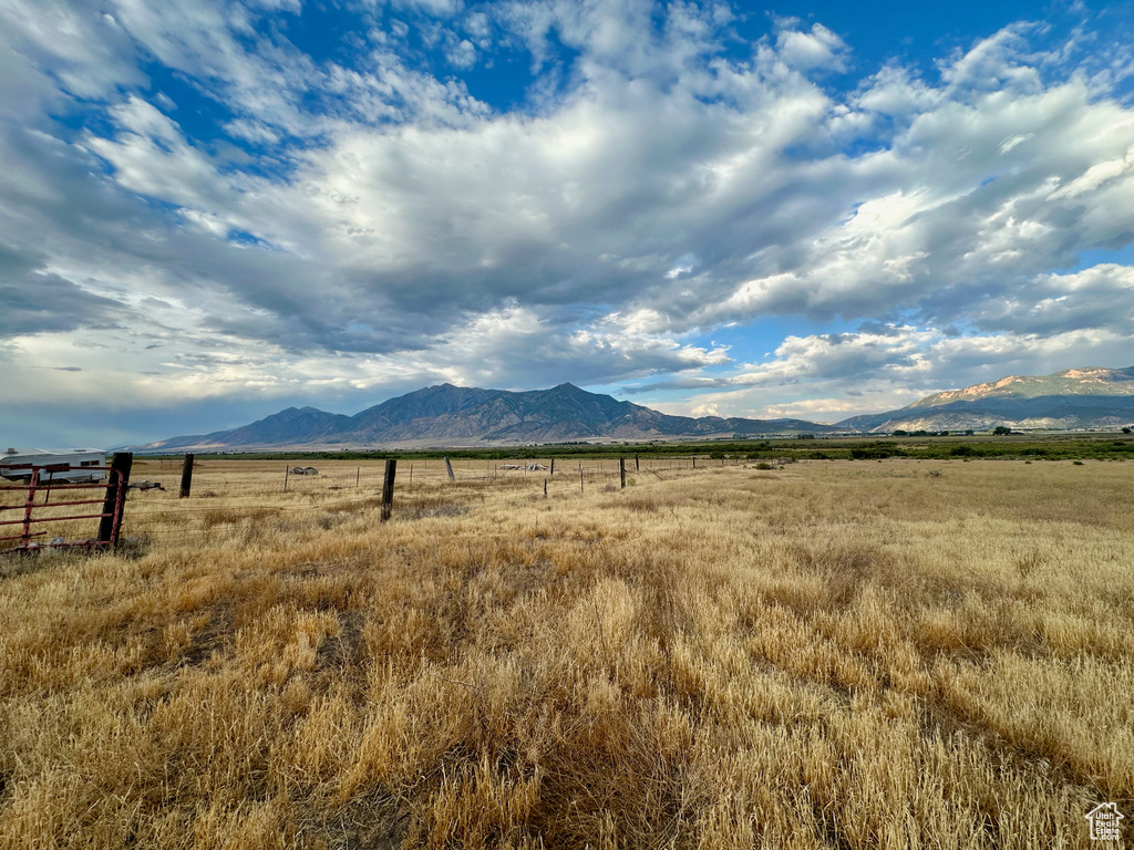 Property view of mountains with a rural view