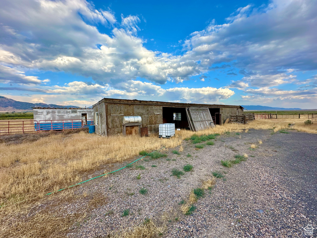 View of outdoor structure featuring a rural view and a mountain view