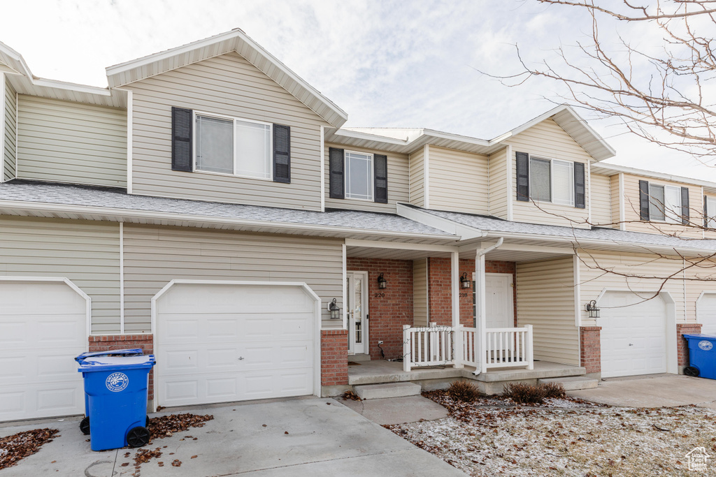 Townhome / multi-family property with a garage