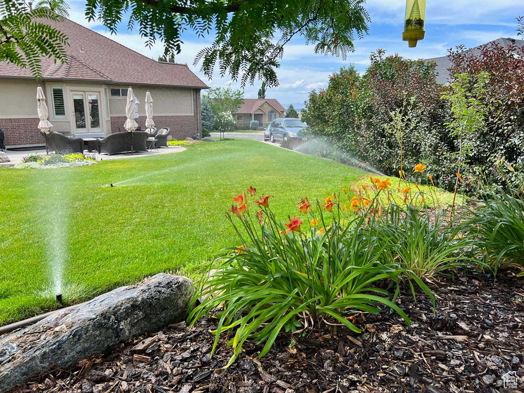 View of yard with french doors