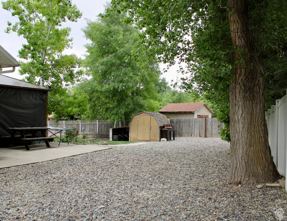 Fenced backyard featuring a patio