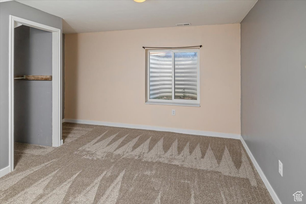 Unfurnished bedroom with carpet floors and a closet