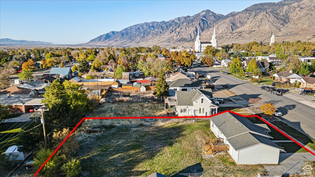 Birds eye view of property with a mountain view