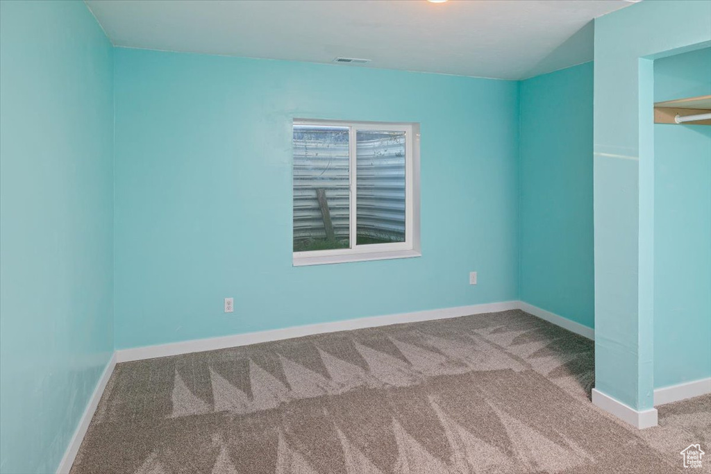 Spare room featuring carpet floors