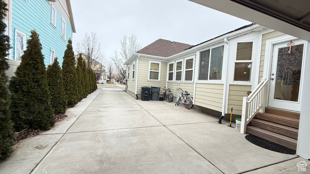 View of side of property with a patio