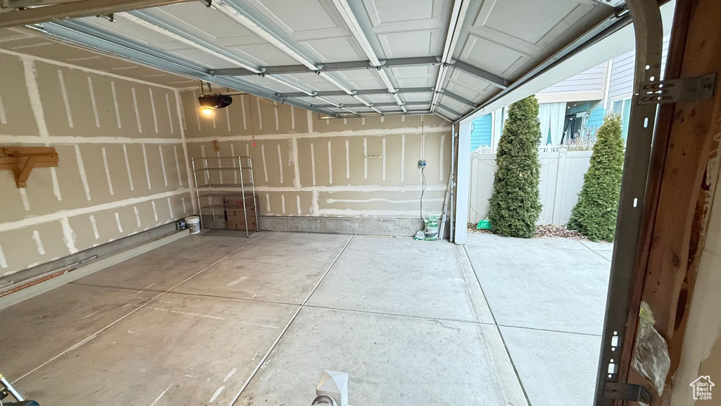 Garage featuring a garage door opener