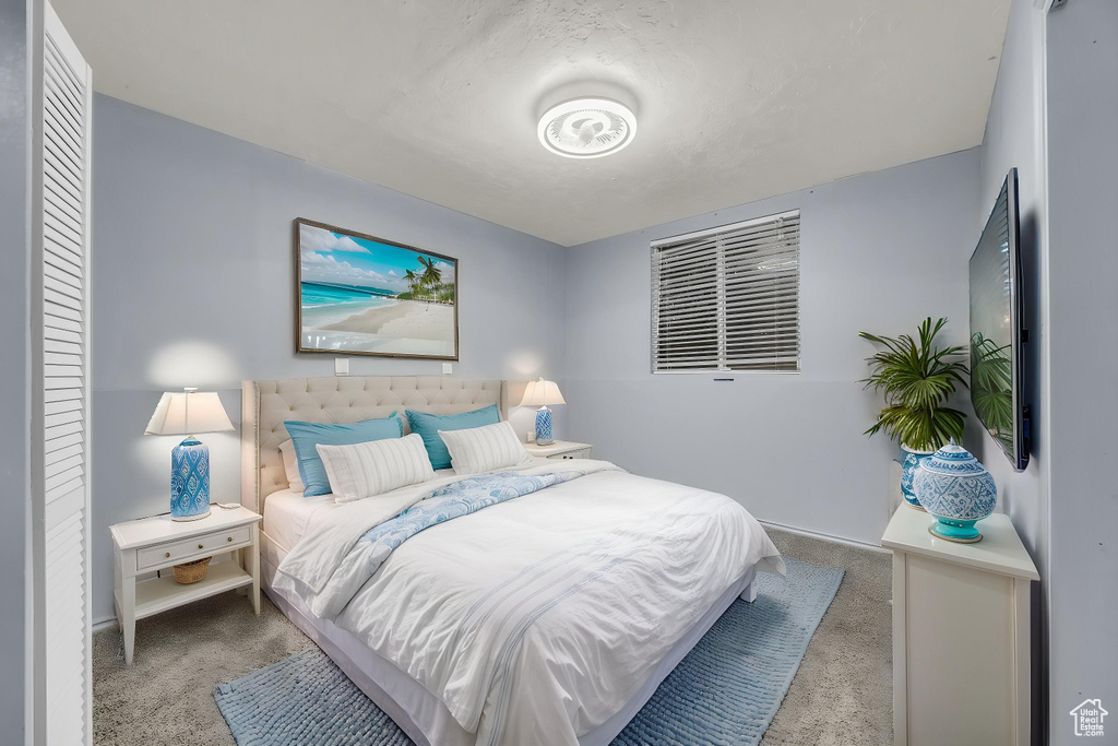 Bedroom with baseboards and carpet flooring