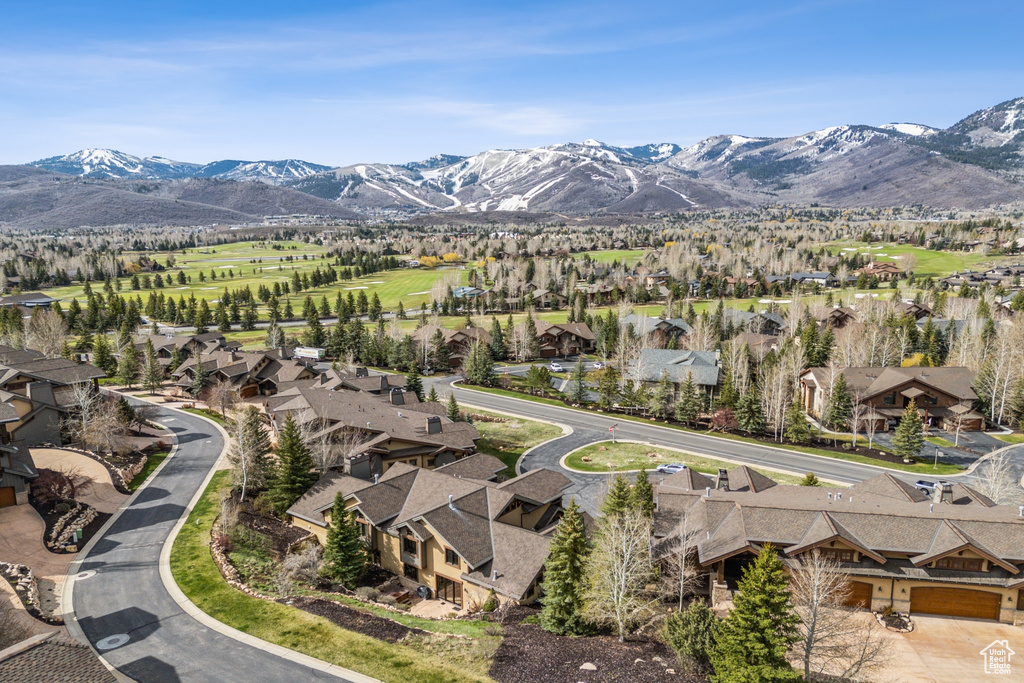 Aerial perspective of suburban area featuring a mountainous background