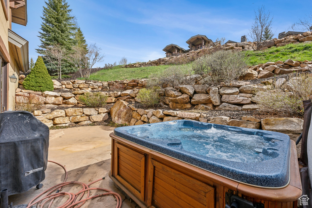 View of patio featuring a hot tub and area for grilling
