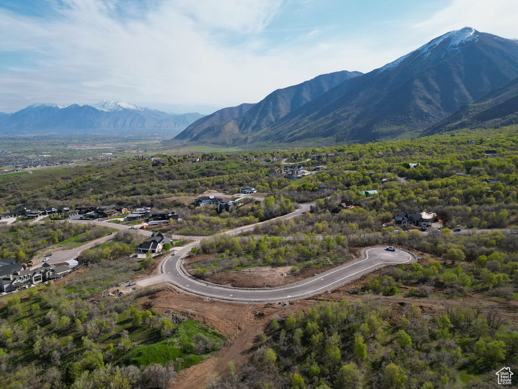 Aerial view of property's location with a mountainous background
