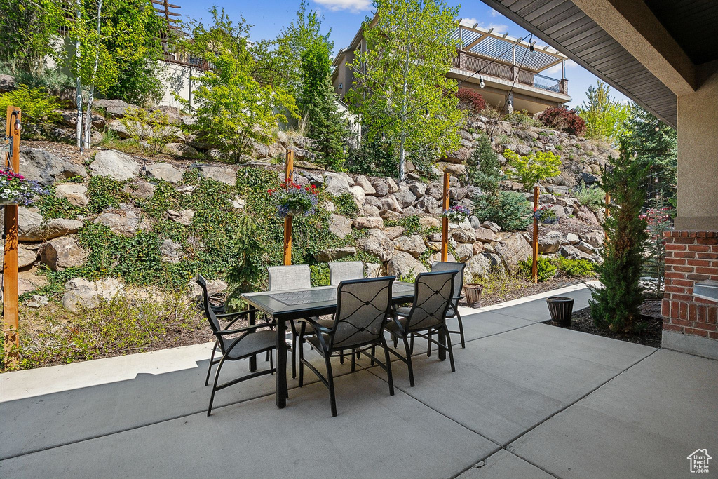 View of patio featuring outdoor dining area