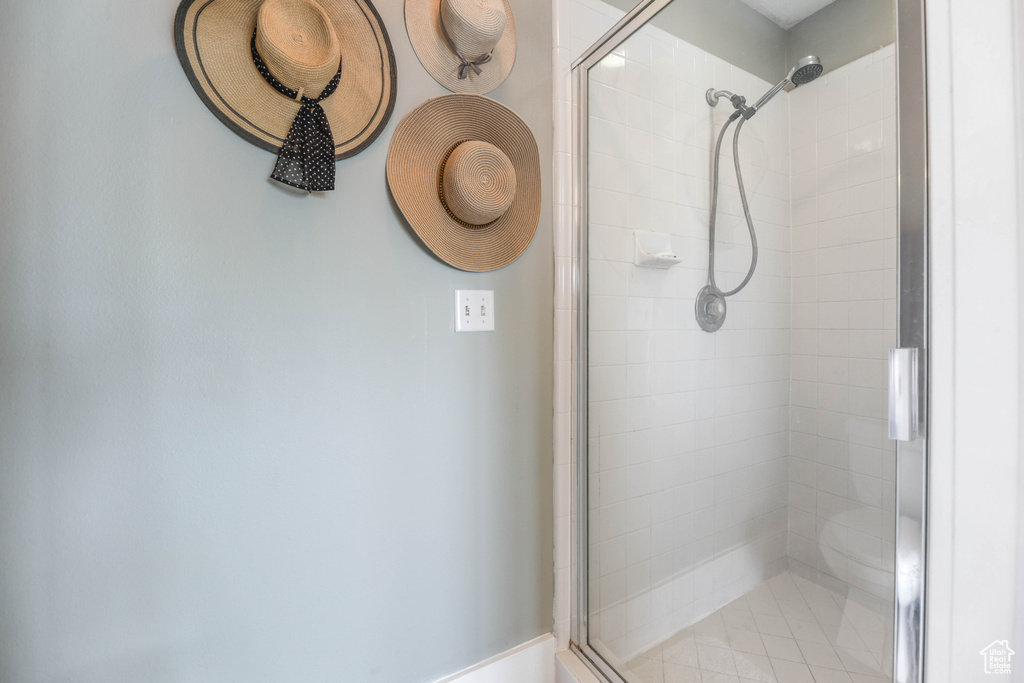 Full bath featuring a shower stall