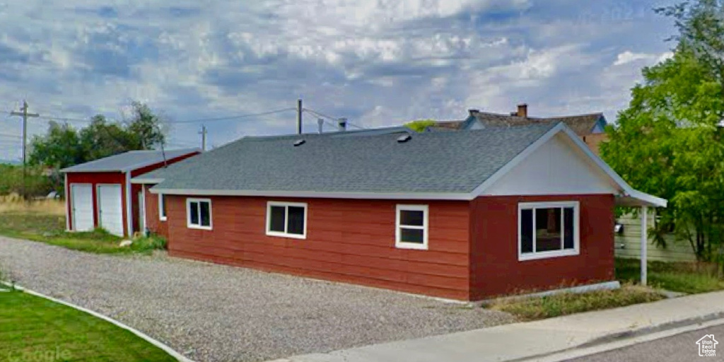 View of property exterior featuring a garage