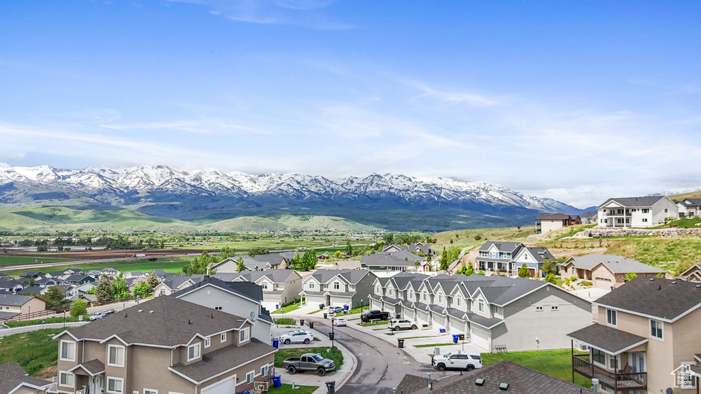 Aerial perspective of suburban area featuring a mountain backdrop