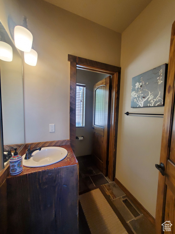 Bathroom featuring vanity and tile patterned floors