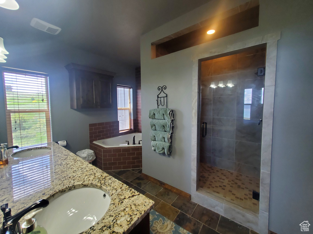 Full bathroom with vanity, a bath, a shower stall, and recessed lighting
