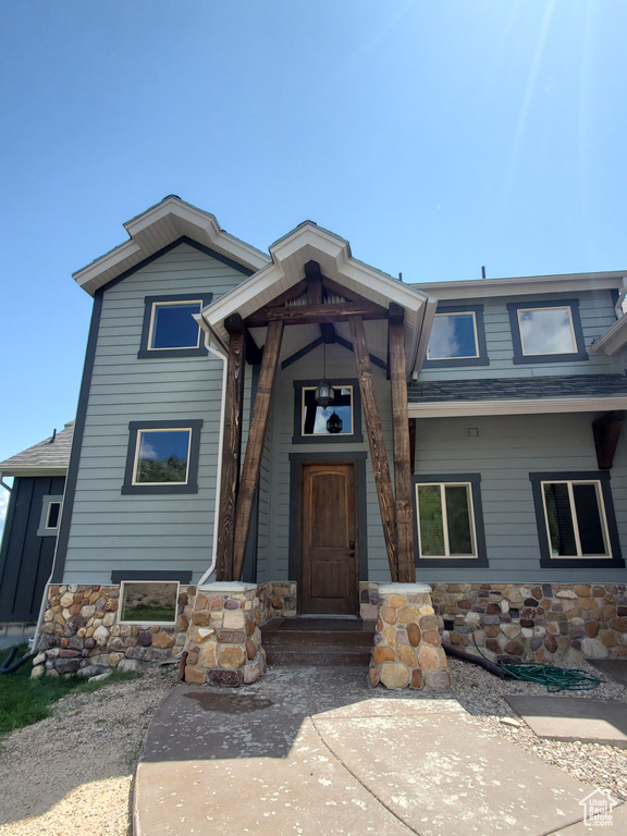 View of front facade with a shingled roof
