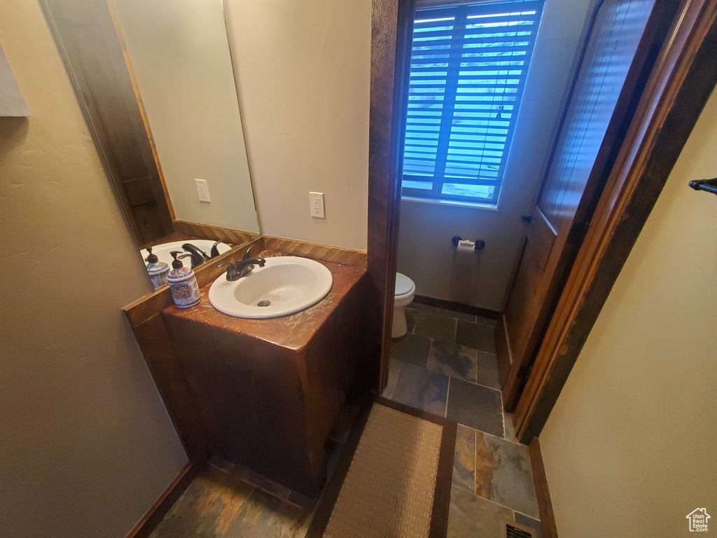 Bathroom with vanity and toilet