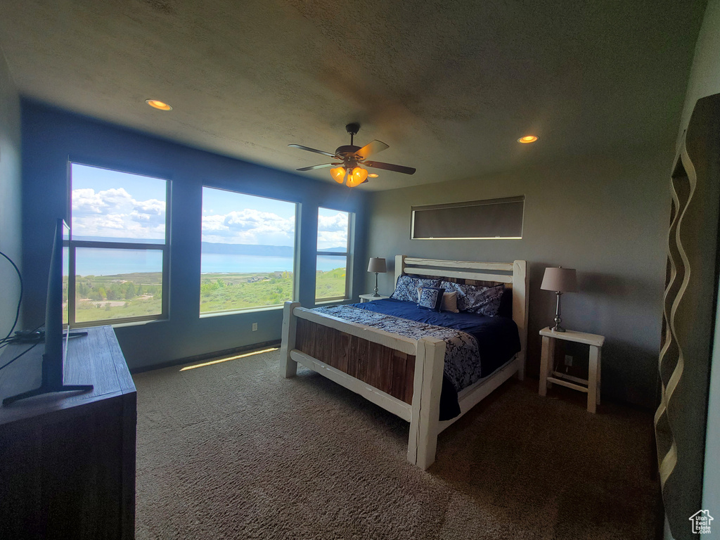 Bedroom featuring carpet flooring, recessed lighting, ceiling fan, and baseboards