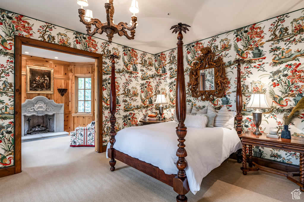 Carpeted bedroom featuring wallpapered walls