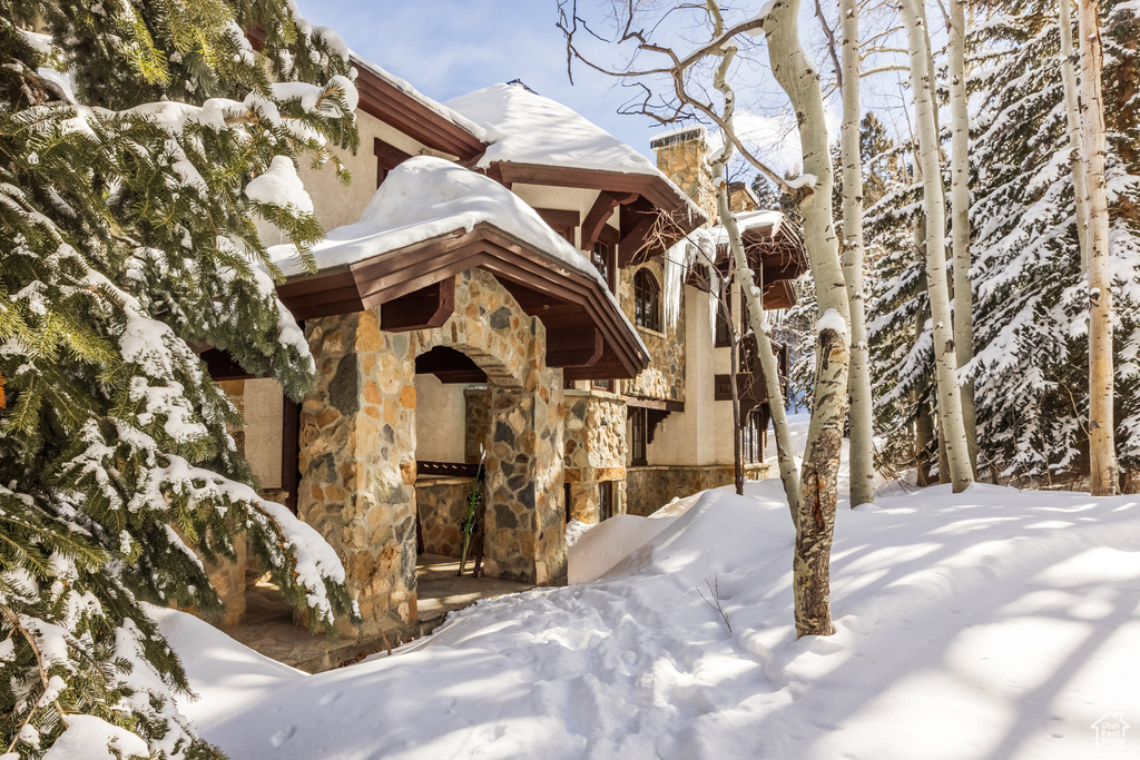 View of front of house with stone siding