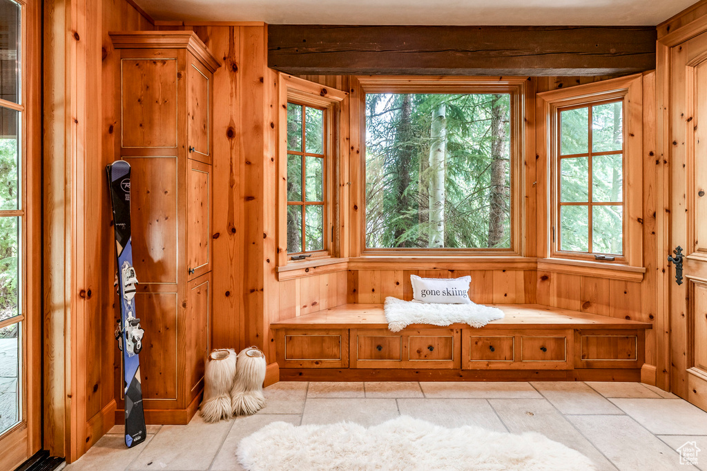 Unfurnished room with wood walls