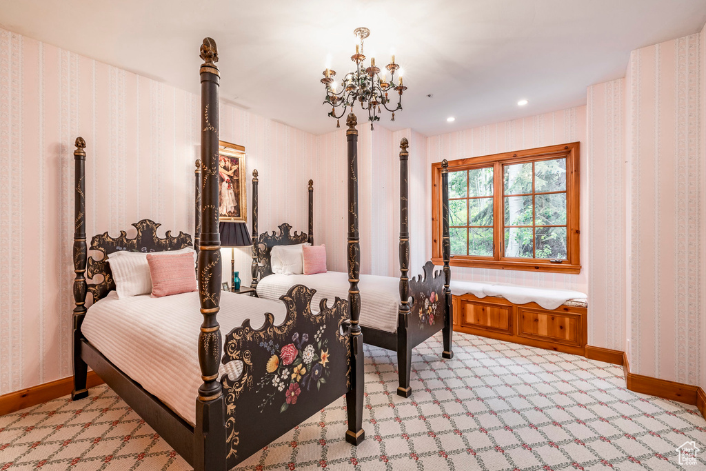 Bedroom featuring a chandelier, light carpet, recessed lighting, and wallpapered walls