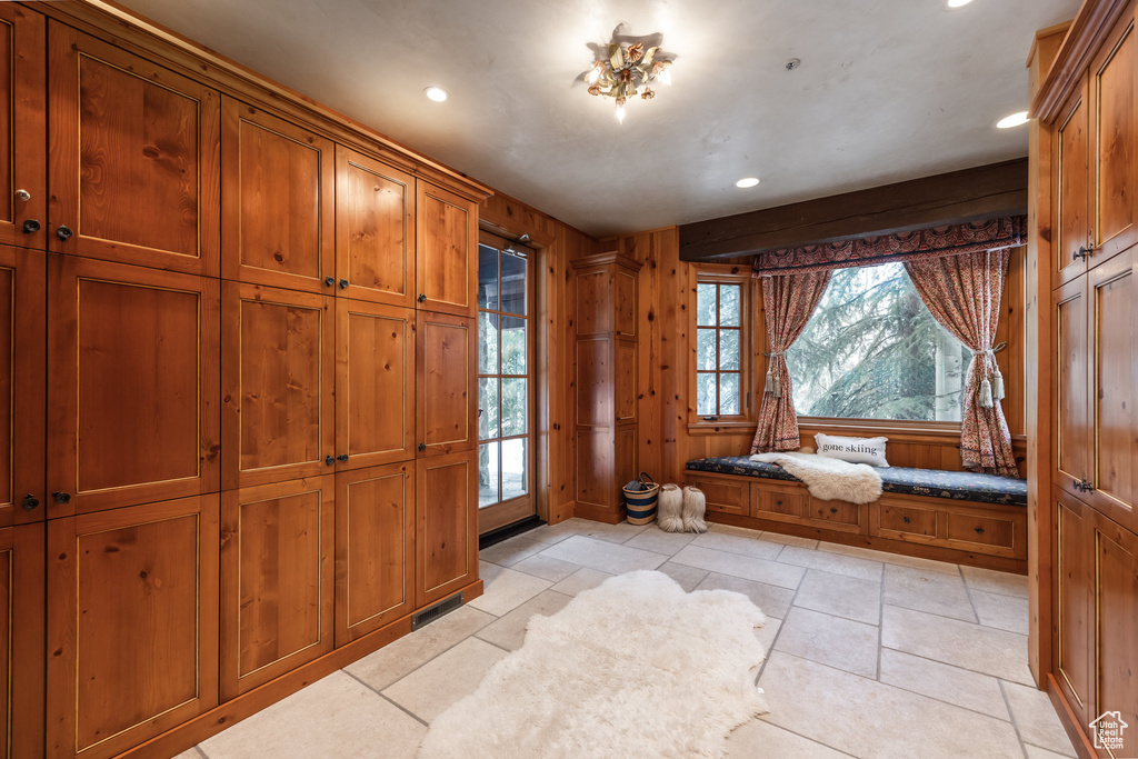 Mudroom featuring recessed lighting, wooden walls, and visible vents