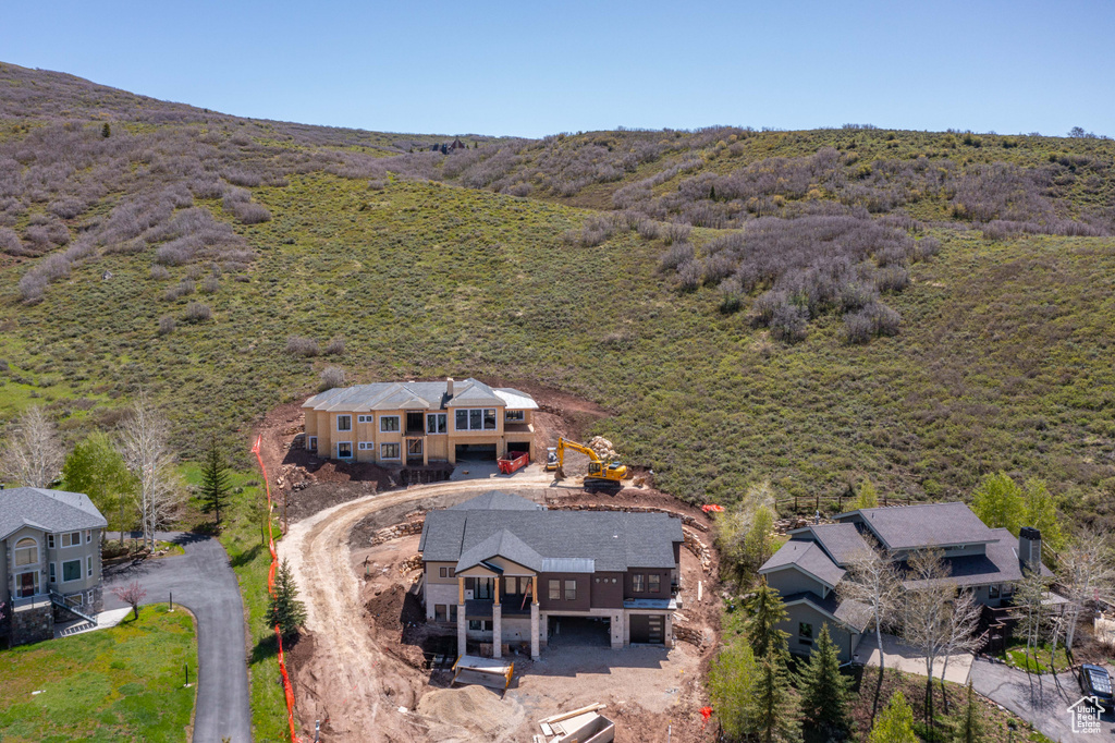 Aerial view of property and surrounding area featuring a heavily wooded area and property boundaries highlighted