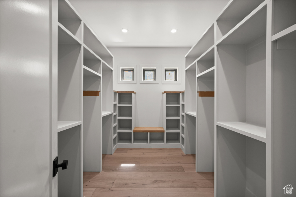 Spacious closet with light wood-style floors