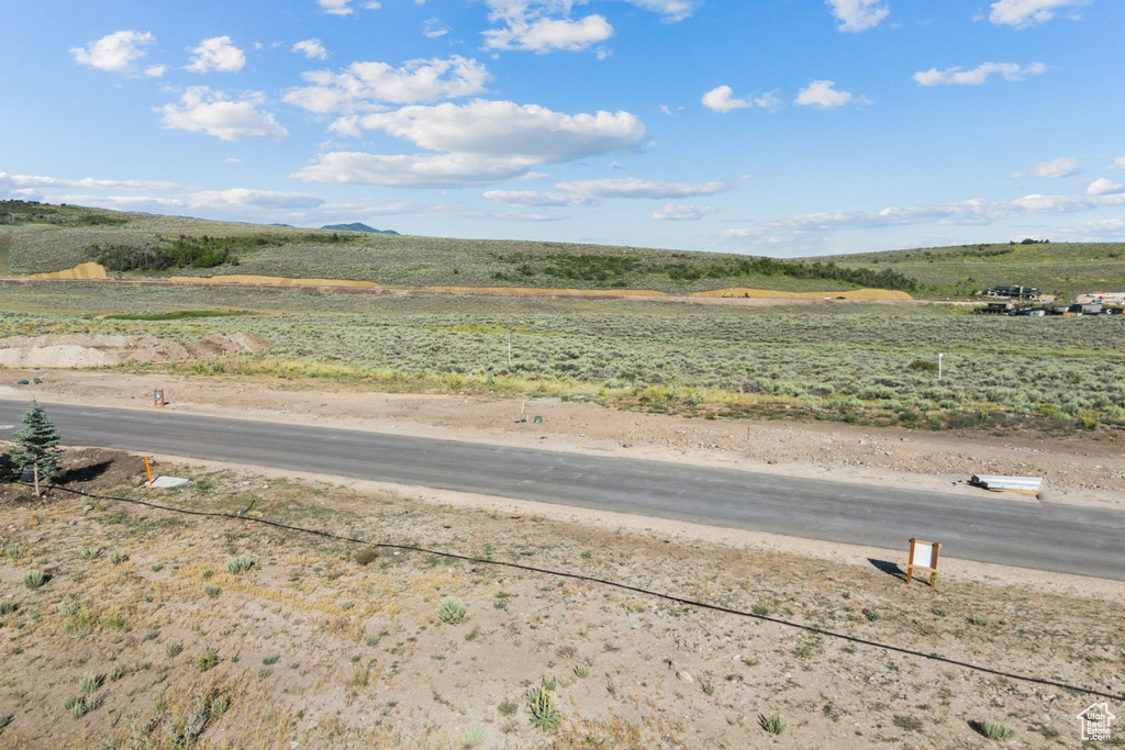 View of asphalt street featuring a rural view
