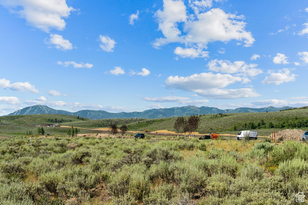View of mountain backdrop with rural landscape