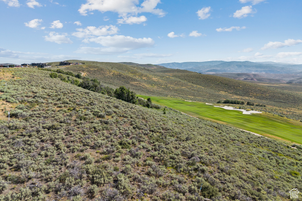 View of mountain backdrop with a golf course