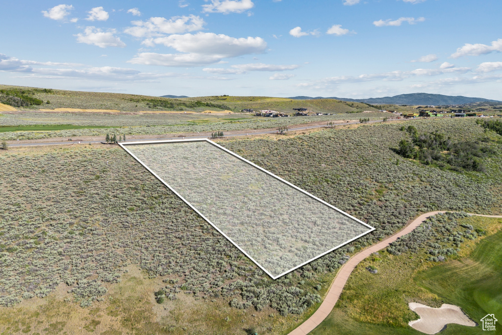 View of rural area featuring property boundaries highlighted and a mountainous background