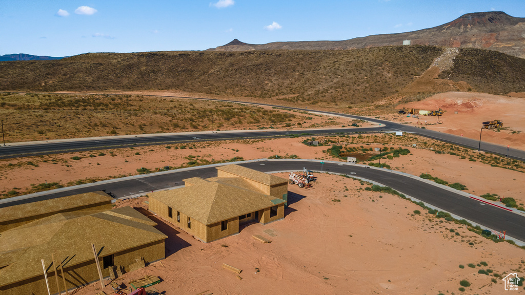 Birds eye view of property with a mountain view