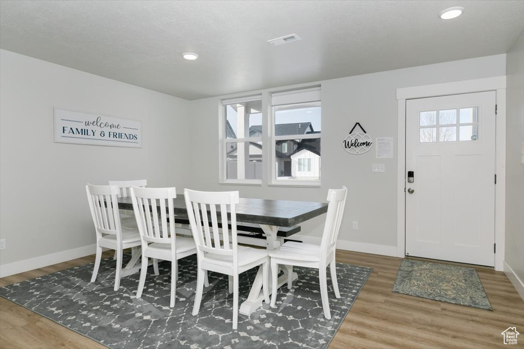 Dining space featuring hardwood / wood-style flooring