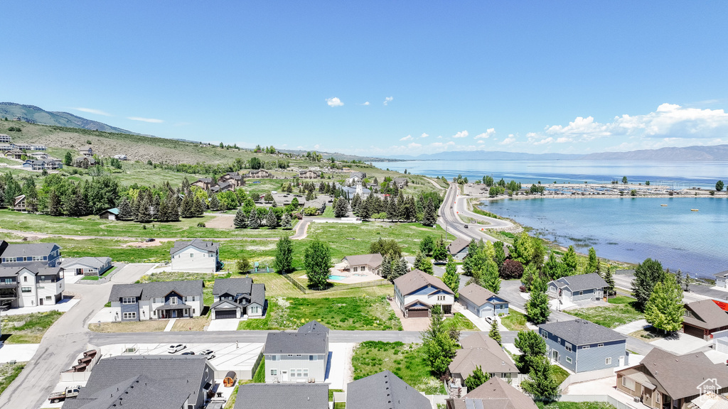 Aerial view of residential area featuring a water and mountain view