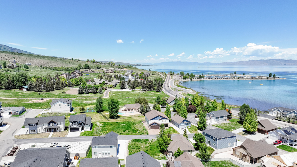Aerial perspective of suburban area with a water and mountain view