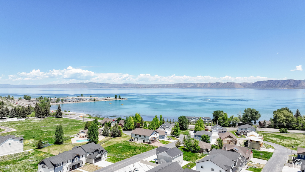 Aerial view of residential area featuring a water and mountain view