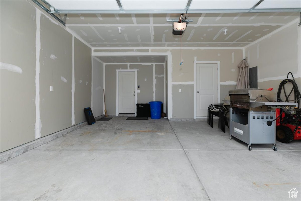 Garage with a garage door opener and electric panel