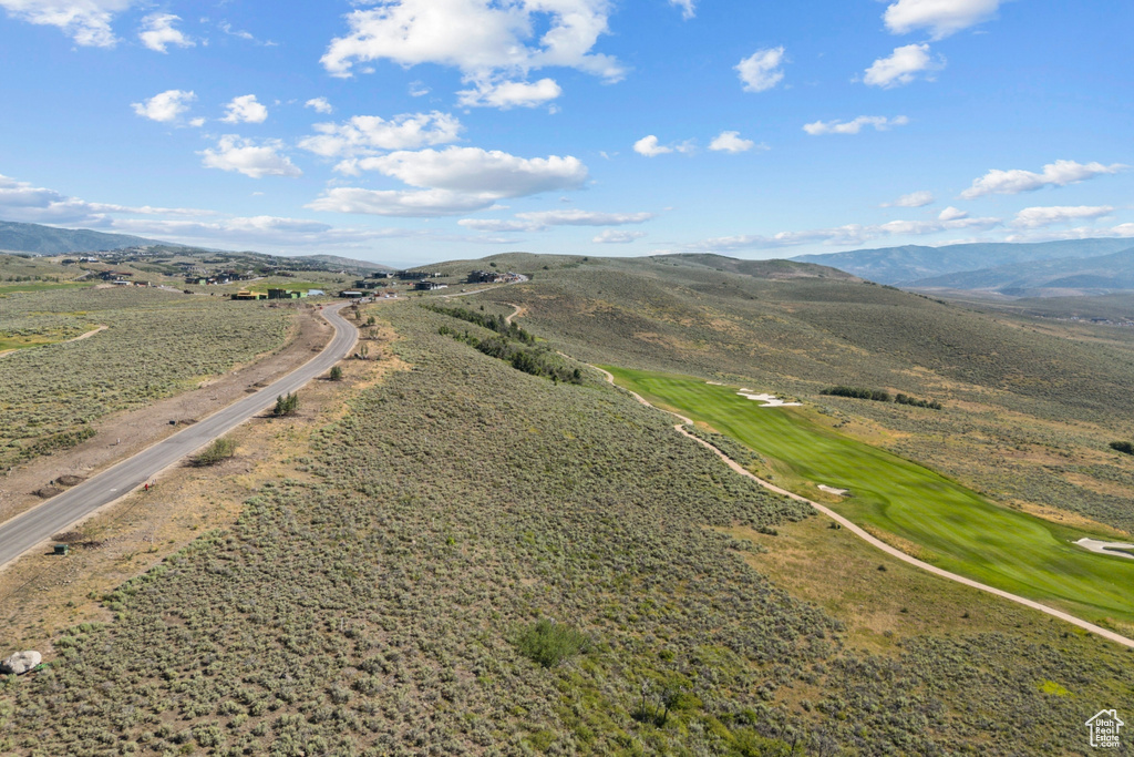 Bird's eye view of mountains and a local golf course