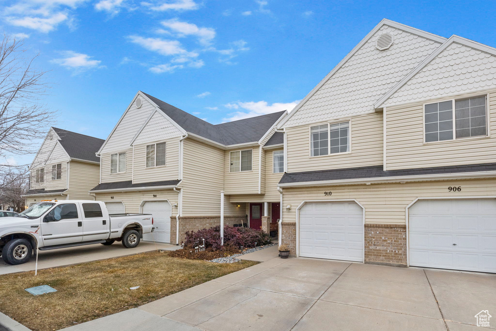 View of property with a garage