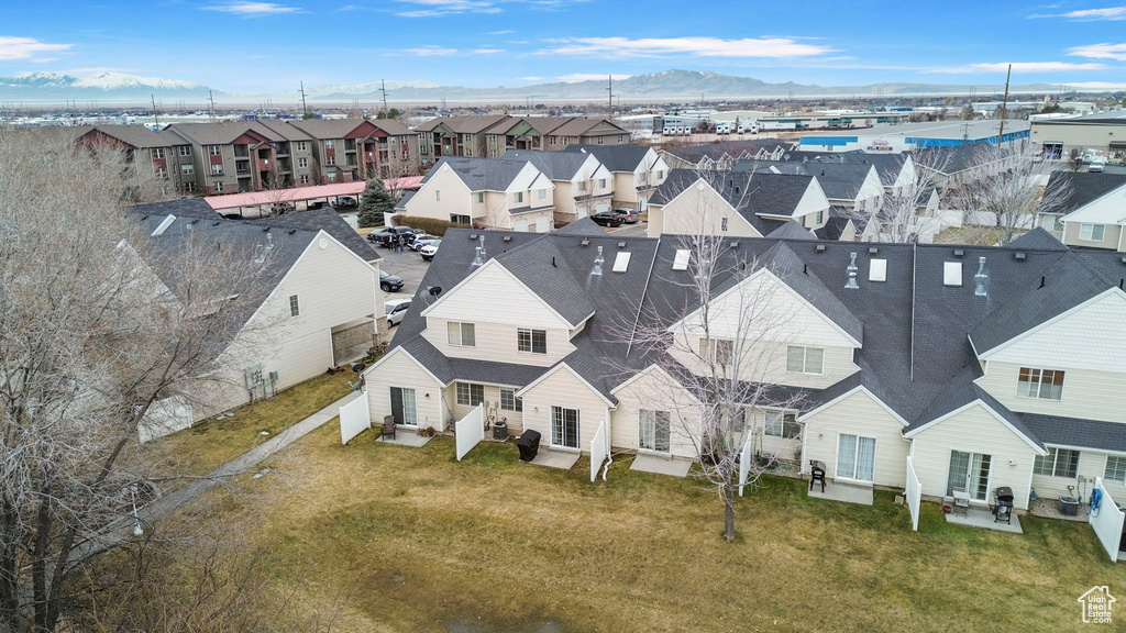 Birds eye view of property with a mountain view