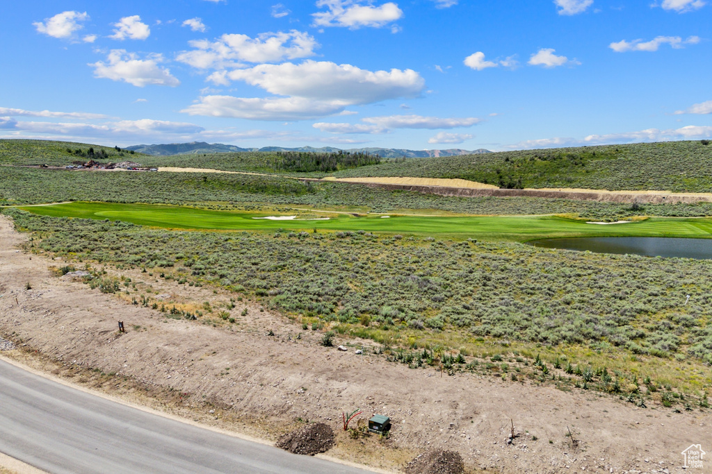 Bird's eye view of a water and mountain view and a local golf course