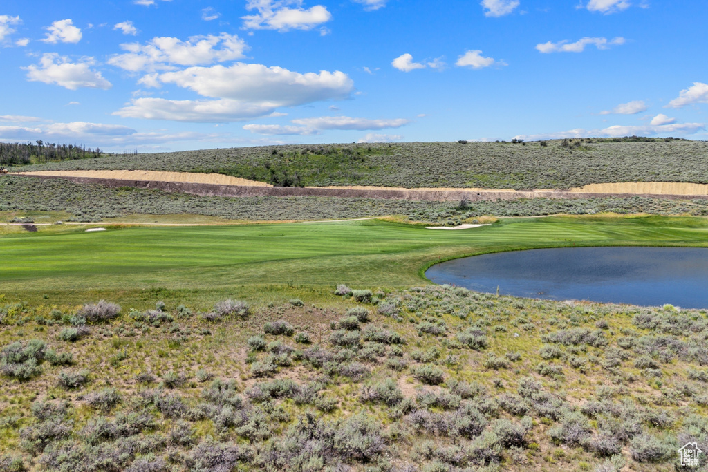 View of property's community featuring a water view and view of golf course