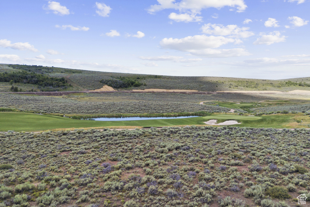 View of yard featuring a water view and golf course view