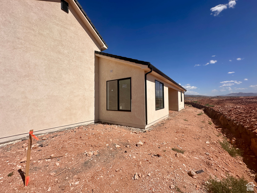 View of property exterior featuring stucco siding
