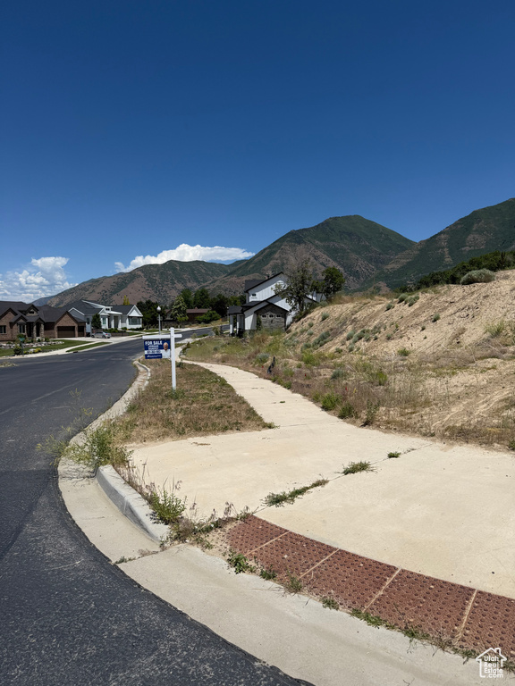 View of asphalt street with a mountain view