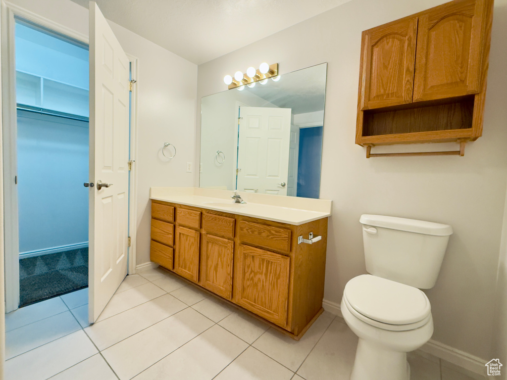 Bathroom with vanity and tile patterned floors
